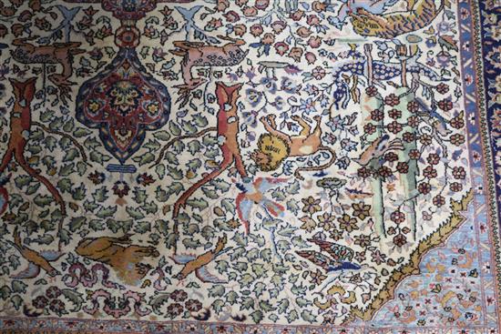A Persian Tree of life ivory ground carpet W.275 x 180cm